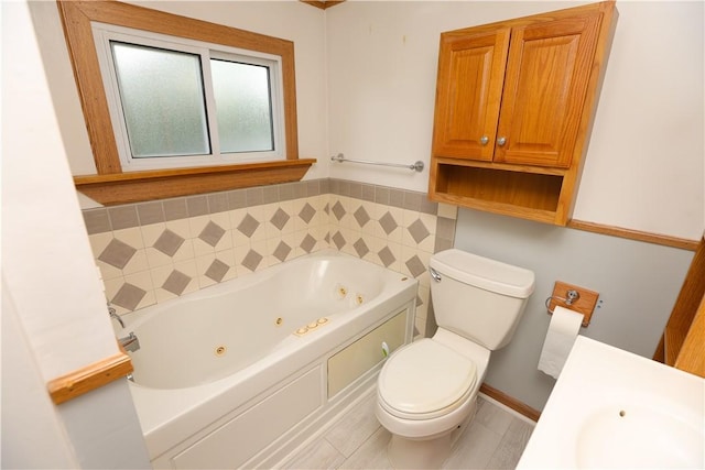 23 Main St, W Pike Run Twp, PA 15427 - bathroom featuring a whirlpool tub, toilet, and vanity