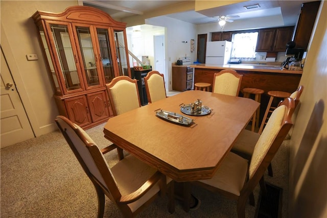 23 Main St, W Pike Run Twp, PA 15427 - dining space featuring a ceiling fan and light carpet