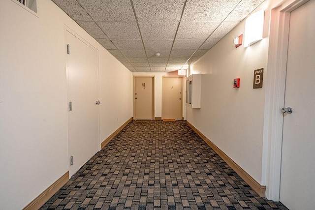333 S Highland Ave Unit 303, Shadyside, PA 15206 - corridor with a drop ceiling, baseboards, and brick patterned flooring