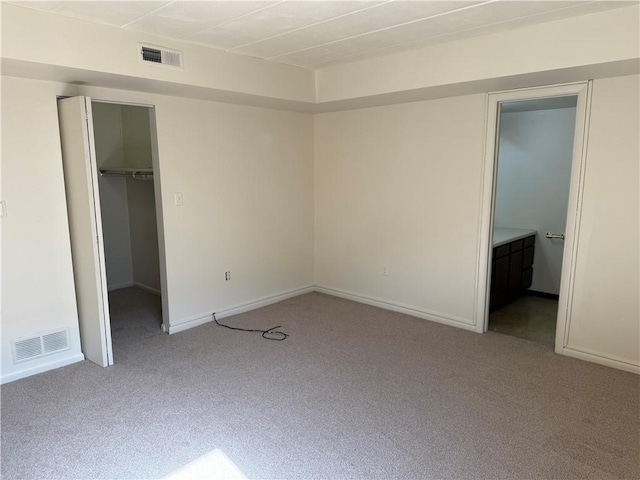 333 S Highland Ave Unit 303, Shadyside, PA 15206 - unfurnished bedroom with carpet flooring, a walk in closet, a closet, and baseboards