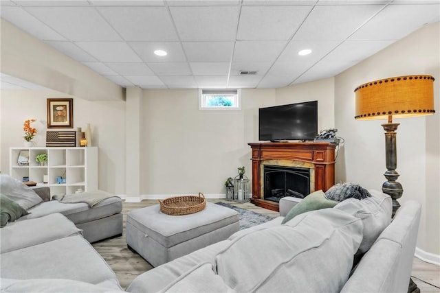 127 Aberdeen Dr, Cranberry Twp, PA 16066 - living area with baseboards, recessed lighting, light wood-style floors, a paneled ceiling, and a fireplace with raised hearth