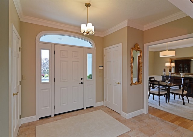 3875 Ashland Ct, Hampton, PA 15101 - foyer with crown molding, baseboards, a chandelier, and light stone finish floors