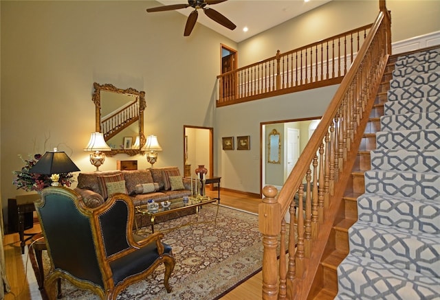 3875 Ashland Ct, Hampton, PA 15101 - living room with wood finished floors, a towering ceiling, ceiling fan, baseboards, and recessed lighting