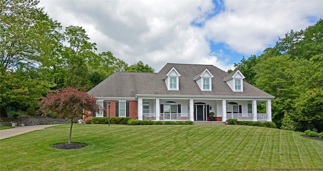 3875 Ashland Ct, Hampton, PA 15101 - cape cod-style house with a porch, a front yard, and brick siding