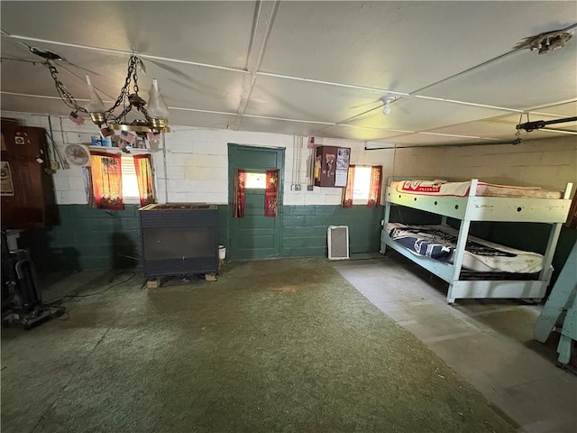 23682 Rte 949, Ridgway, PA 15853 - garage featuring concrete block wall and a wood stove