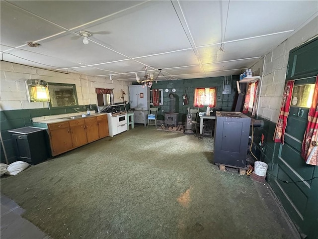 23682 Rte 949, Ridgway, PA 15853 - kitchen with a wood stove and concrete block wall