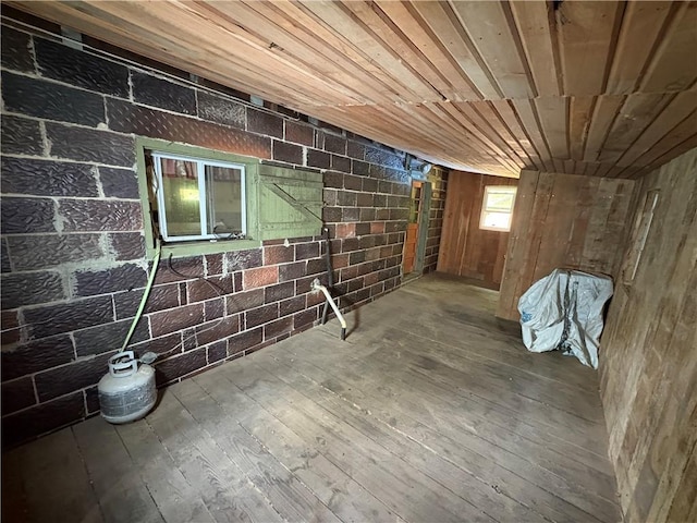 23682 Rte 949, Ridgway, PA 15853 - basement with hardwood / wood-style flooring, wood walls, wood ceiling, and brick wall