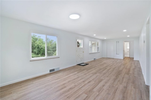 55 Lawrence St, Shaler, PA 15209 - unfurnished living room featuring healthy amount of natural light, light wood-type flooring, baseboards, and recessed lighting