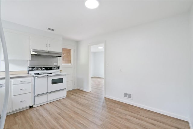 55 Lawrence St, Shaler, PA 15209 - kitchen featuring white electric stove, under cabinet range hood, light wood-type flooring, baseboards, and white cabinets