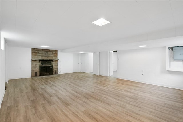 55 Lawrence St, Shaler, PA 15209 - unfurnished living room featuring light wood finished floors, a stone fireplace, and baseboards