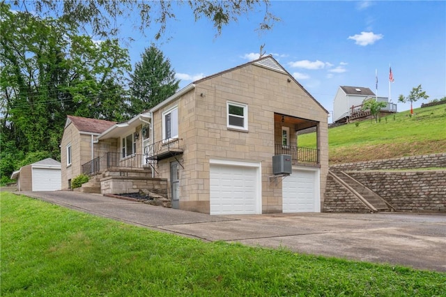 55 Lawrence St, Shaler, PA 15209 - view of front of house featuring a front lawn, a garage, and driveway