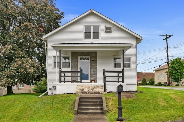 425 Routh Dr, Monroeville, PA 15146 - view of front of house featuring a porch, a front lawn, and stone siding