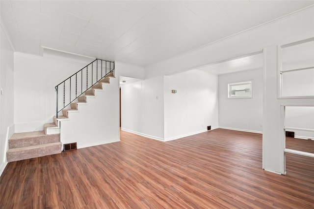 425 Routh Dr, Monroeville, PA 15146 - unfurnished living room with stairway, wood finished floors, and baseboards