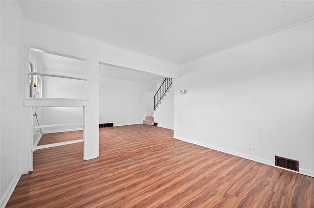 425 Routh Dr, Monroeville, PA 15146 - below grade area featuring wood finished floors, stairway, baseboards, and crown molding