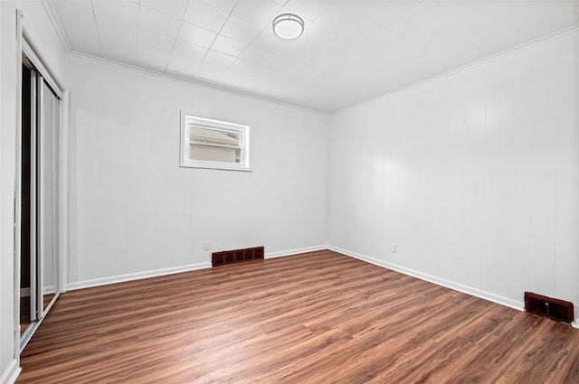 425 Routh Dr, Monroeville, PA 15146 - unfurnished bedroom with crown molding, wood finished floors, a closet, and baseboards