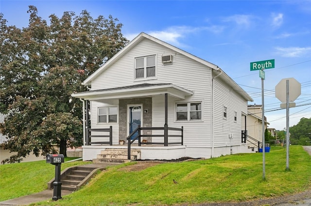 425 Routh Dr, Monroeville, PA 15146 - view of front of home featuring a front yard, an AC wall unit, and covered porch