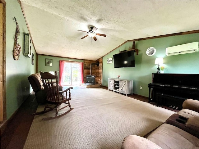 2513 Old Rte 18, New Beaver Boro, PA 16157 - living area with a wall unit AC, a wood stove, a ceiling fan, a textured ceiling, and lofted ceiling