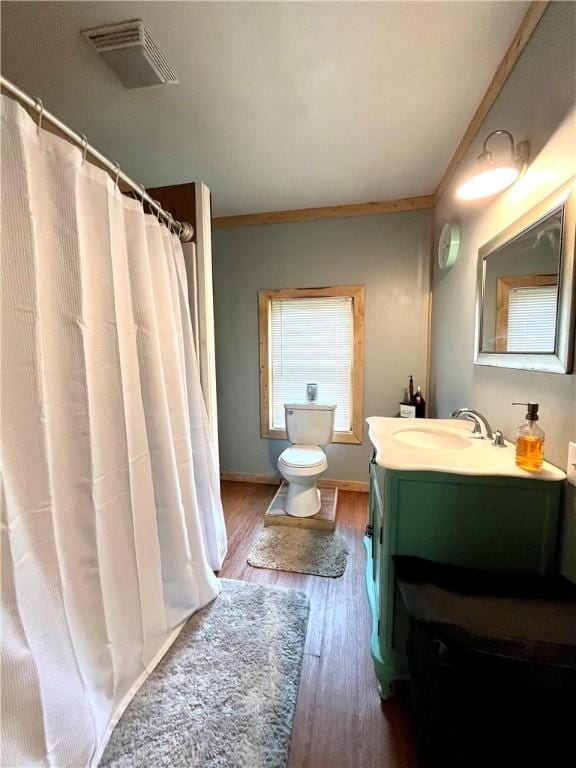 2513 Old Rte 18, New Beaver Boro, PA 16157 - bathroom featuring vanity, wood finished floors, toilet, baseboards, and curtained shower
