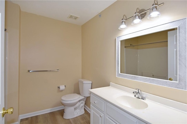1201 Lenox Oval, Ross Twp, PA 15237 - bathroom featuring wood finished floors, toilet, vanity, baseboards, and a shower