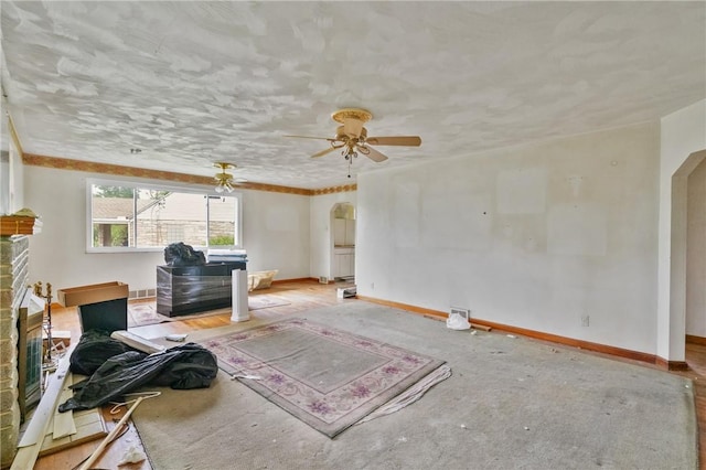828 Georgia Ave, Bon Air, PA 15210 - living room featuring arched walkways, baseboards, and a ceiling fan