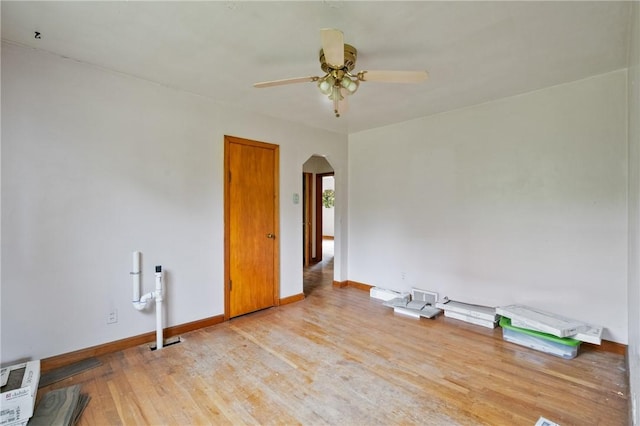 828 Georgia Ave, Bon Air, PA 15210 - unfurnished room featuring arched walkways, ceiling fan, baseboards, and wood finished floors