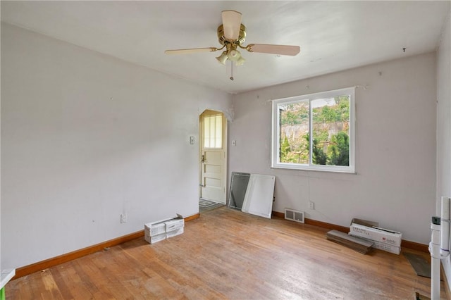 828 Georgia Ave, Bon Air, PA 15210 - empty room featuring ceiling fan, baseboards, wood finished floors, and arched walkways