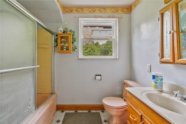 828 Georgia Ave, Bon Air, PA 15210 - full bathroom with tile patterned floors, vanity, toilet, baseboards, and shower / bath combination with glass door