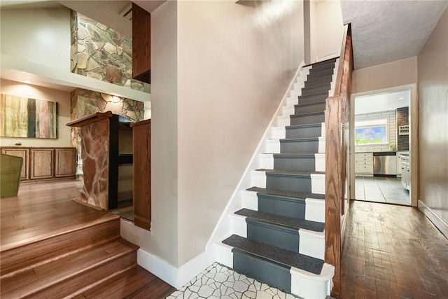 1521 Claim St, Troy Hill, PA 15212 - staircase with hardwood / wood-style flooring and baseboards