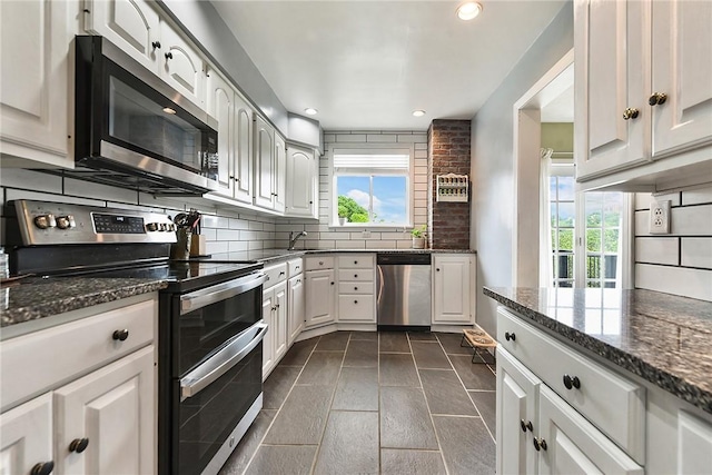 1521 Claim St, Troy Hill, PA 15212 - kitchen with appliances with stainless steel finishes, healthy amount of natural light, tasteful backsplash, and recessed lighting