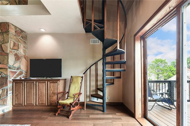 1521 Claim St, Troy Hill, PA 15212 - staircase with healthy amount of natural light, wood finished floors, and baseboards