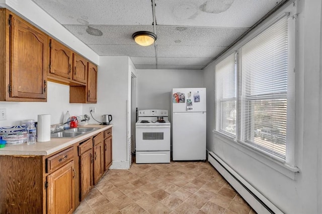 1303 Alton St, Beechview, PA 15216 - kitchen with white appliances, a sink, a baseboard heating unit, a paneled ceiling, and light countertops