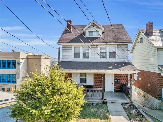 1303 Alton St, Beechview, PA 15216 - view of front facade featuring covered porch, a chimney, and brick siding