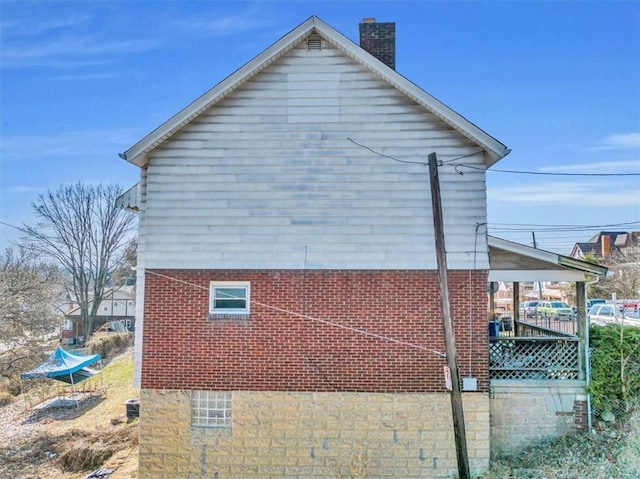 1303 Alton St, Beechview, PA 15216 - view of home's exterior featuring a chimney and brick siding
