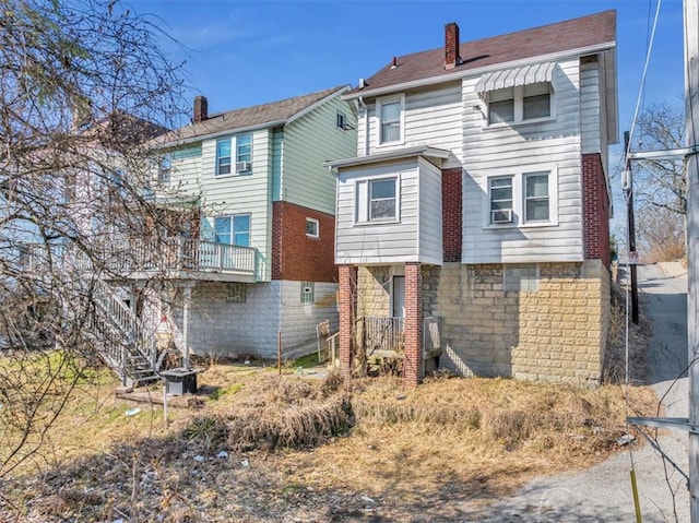 1303 Alton St, Beechview, PA 15216 - back of property featuring a chimney, cooling unit, and stairs