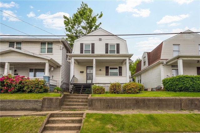 548 Conrad Ave, Charleroi Boro, PA 15022 - colonial inspired home featuring a porch, a front lawn, stairs, and a gambrel roof