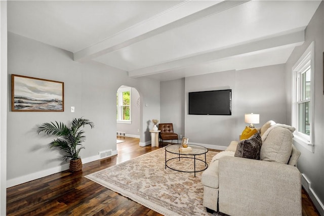 548 Conrad Ave, Charleroi Boro, PA 15022 - living room featuring arched walkways, beam ceiling, dark wood-type flooring, and baseboards