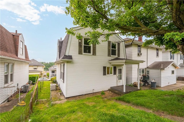 548 Conrad Ave, Charleroi Boro, PA 15022 - back of house with a chimney, cooling unit, and a gambrel roof