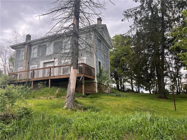 609 Trout Run Rd, Punxsutawney Area School District, PA 15767 - rear view of house featuring a chimney and a deck