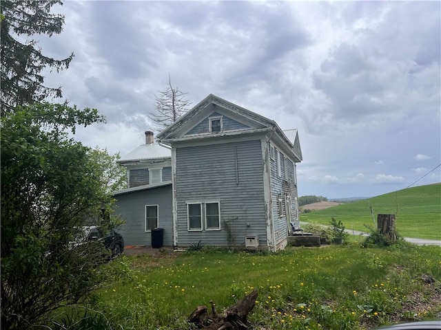 609 Trout Run Rd, Punxsutawney Area School District, PA 15767 - rear view of property featuring a yard and a chimney