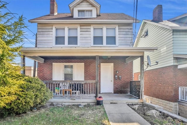 1303 Alton St, Beechview, PA 15216 - traditional style home featuring a porch, brick siding, and a chimney