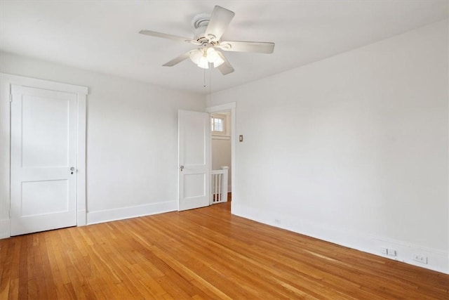 5465 Coral St, Friendship Park, PA 15206 - spare room featuring light wood-style floors, baseboards, and a ceiling fan