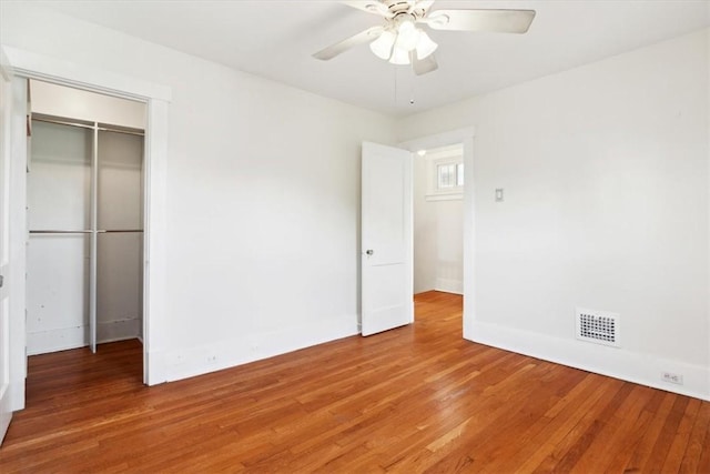 5465 Coral St, Friendship Park, PA 15206 - unfurnished bedroom featuring light wood-type flooring, baseboards, a closet, and ceiling fan
