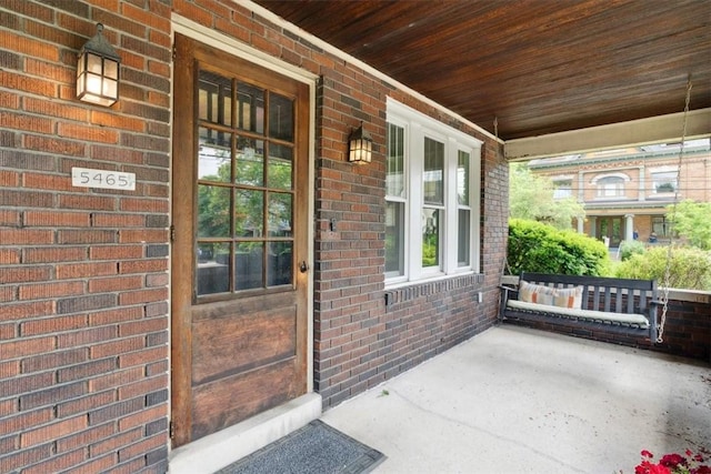 5465 Coral St, Friendship Park, PA 15206 - doorway to property featuring a porch and brick siding