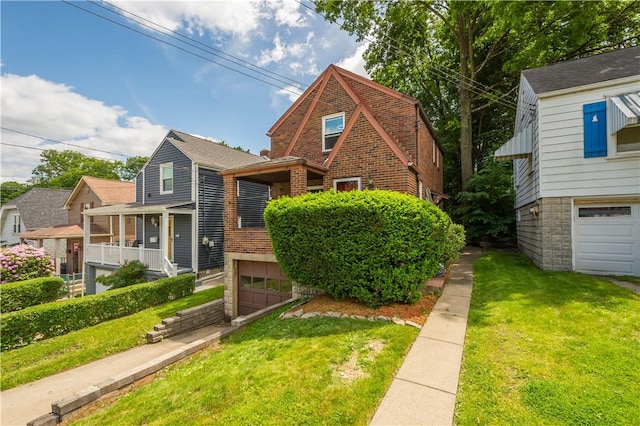 1415 Oakglen St, Crafton Heights, PA 15204 - view of front facade featuring an attached garage, a front yard, and brick siding