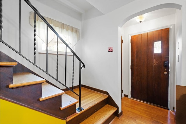 1415 Oakglen St, Crafton Heights, PA 15204 - entryway featuring arched walkways, stairway, wood finished floors, and baseboards