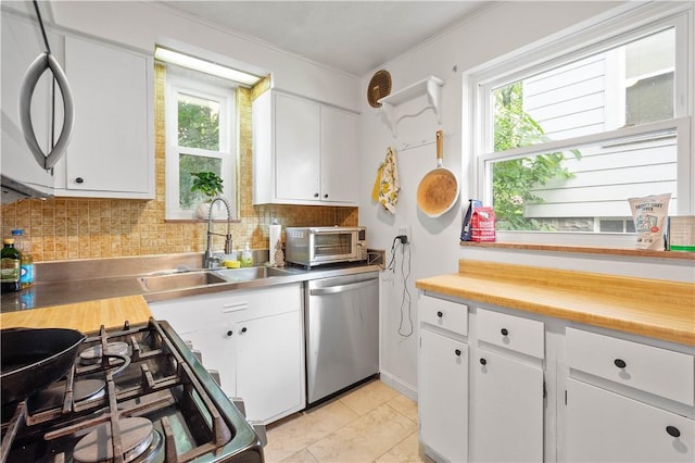 1415 Oakglen St, Crafton Heights, PA 15204 - kitchen featuring dishwasher, a sink, healthy amount of natural light, and backsplash