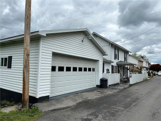42 Walnut Ave, Dunbar, PA 15431 - view of side of property featuring an attached garage and driveway