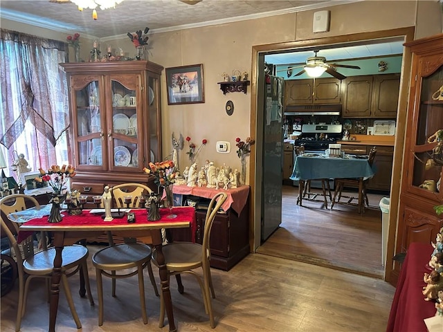 42 Walnut Ave, Dunbar, PA 15431 - dining space with ceiling fan, light wood-style floors, and ornamental molding