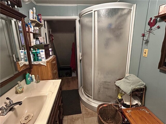 42 Walnut Ave, Dunbar, PA 15431 - bathroom featuring a stall shower, vanity, crown molding, and tile patterned flooring