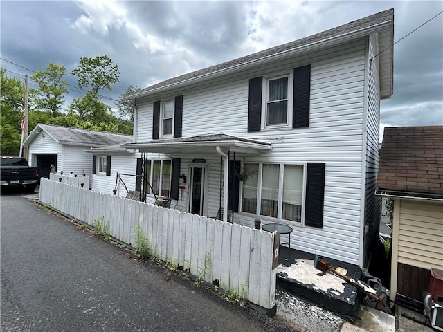 42 Walnut Ave, Dunbar, PA 15431 - traditional-style home featuring covered porch and a garage